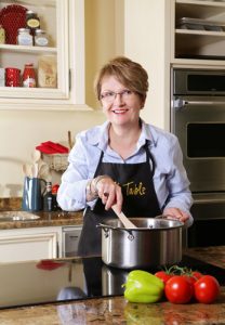 Hands-on owner Jill Wilcox  in the newly renovated demonstration kitchen