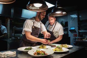 Sous chef Kempton Munshawat (left) and executive chef Jonathan Gushue present compact ingredient-driven menus that change twice daily