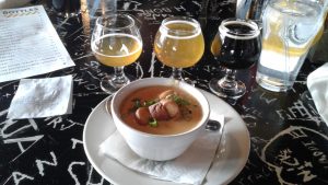  A flight of beer and cheese ale soup made with garden fresh carrots, celery and onion is the start of a delicious lunch at HopCat in Detroit.