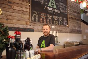 Brewmaster Gavin Anderson behind the bar, the focus of Anderson Craft Ale’s retail operation.